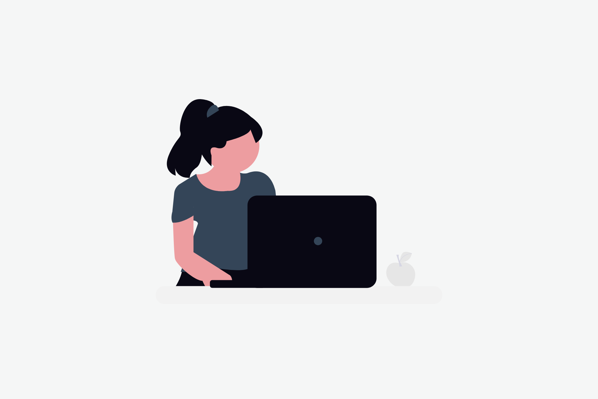 A person behind a laptop typing